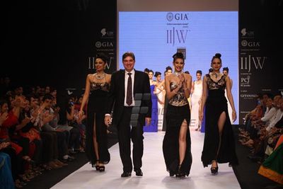 Navneet Kaur and Shobita Dhulipalia walk the ramp for students of IGI