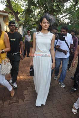 Kangana Ranaut with filmmaker Milan Luthria at the Metro Motors Auto Hangar H M Mehta Trophy 2013