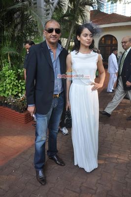 Kangana Ranaut with filmmaker Milan Luthria at the Metro Motors Auto Hangar H M Mehta Trophy 2013