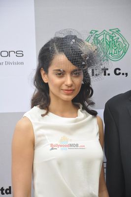 Kangana Ranaut with filmmaker Milan Luthria at the Metro Motors Auto Hangar H M Mehta Trophy 2013