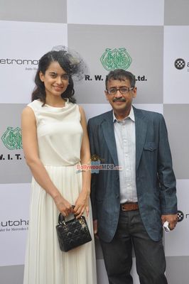 Kangana Ranaut with filmmaker Milan Luthria at the Metro Motors Auto Hangar H M Mehta Trophy 2013