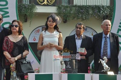 Kangana Ranaut with filmmaker Milan Luthria at the Metro Motors Auto Hangar H M Mehta Trophy 2013