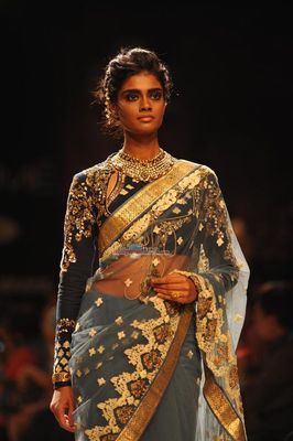 Jacqueline Fernandez walks the ramp for Reliance Jewel Show with Anuj Modi's Couture Collection at LFW Winter Festive 2014