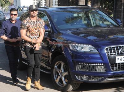 Singer Yo Yo Honey Singh poses with his new Audi Q7 car