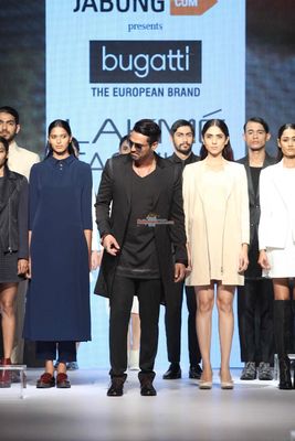 Arjun Rampal showcases a creation by designer Bugatti during Lakme Fashion Week Winter/Festive 2015