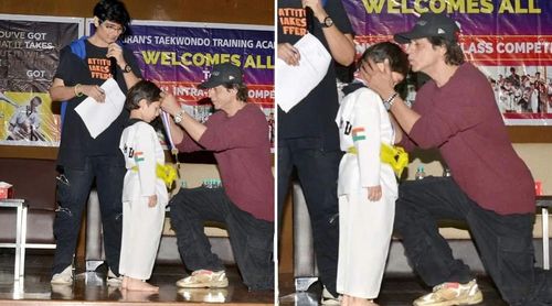 As he gives Taimur a medal for winning the Taekwondo competition, Shah Rukh Khan kisses his forehead