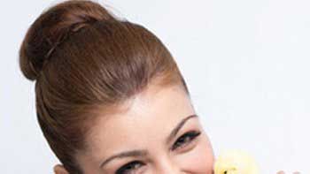 Ayesha Takia poses with a chick for PETA campaign