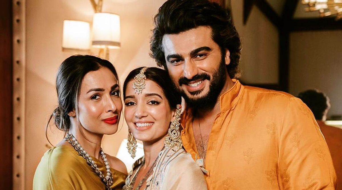 Arjun Kapoor holds beau Malaika Arora close as he welcomes Arpita Mehta into the family