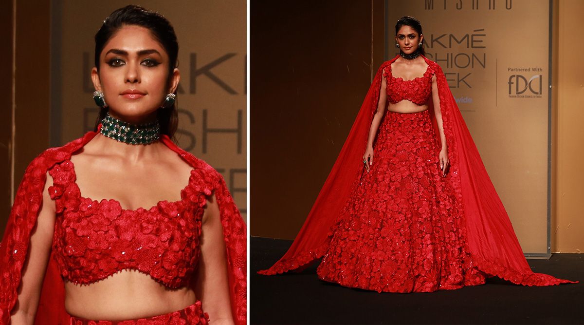 At The FDCI x Lakme Fashion Week, Mrunal Thakur walks the runway wearing a Mishru three-piece crimson lehenga