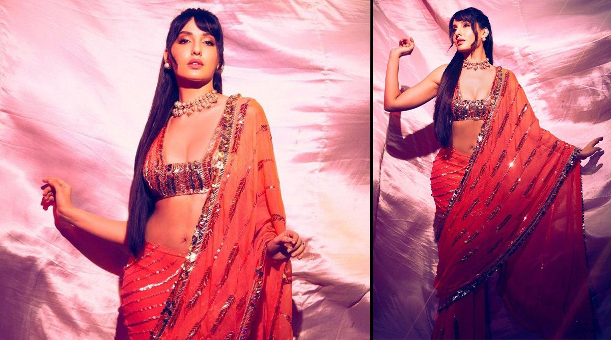 Nora Fatehi looks sultry in an Orange Manish Malhotra saree