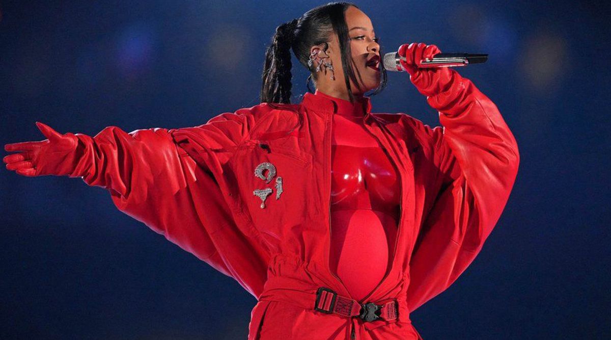 Pregnant Rihanna Cradles Her Baby Bump in Sweet Super Bowl 2023 Photo