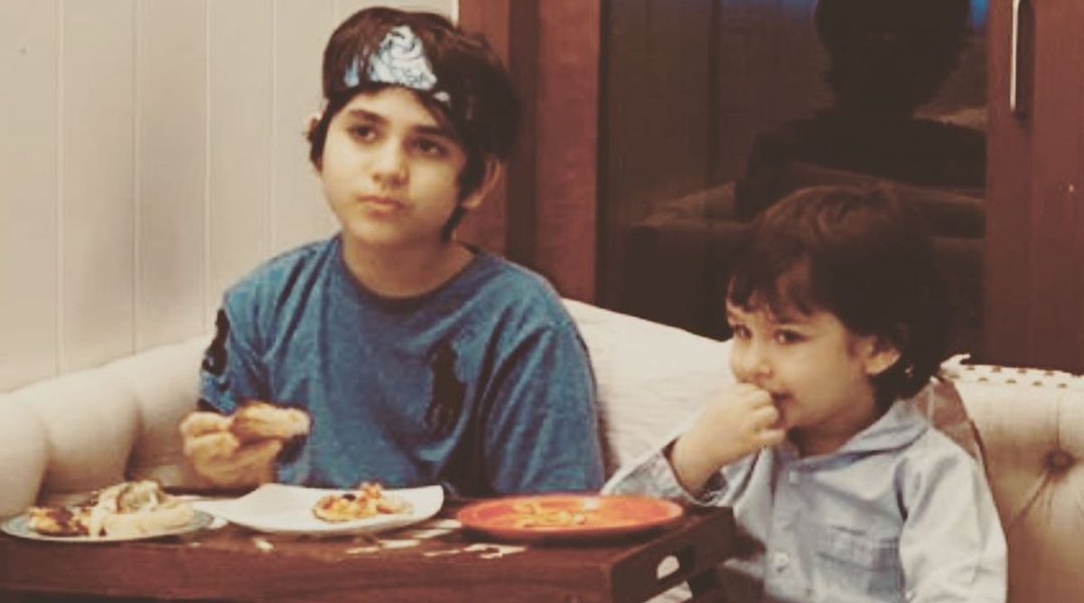 Kareena Kapoor Khan sends her best wishes to Karisma's son Kiaan on his birthday, with a photo of him and Taimur eating pizza in bed